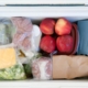top view of a cooler filled with various foods