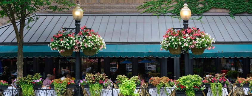 outdoor dining in the rush street district, tastefully decorated with flowers
