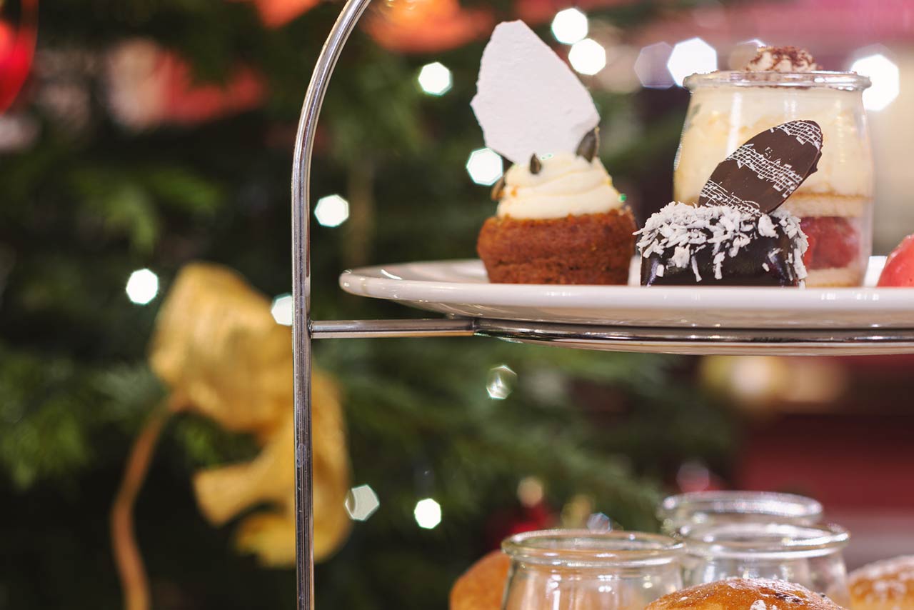 Festive afternoon tea with sandwiches, scones and puddings